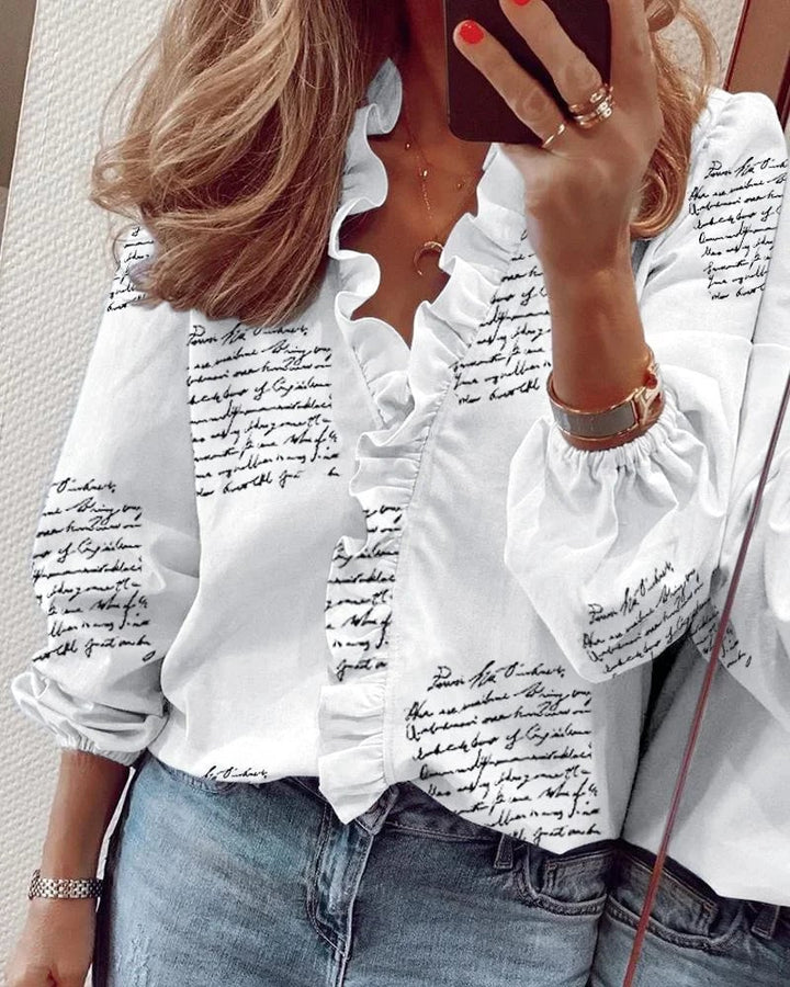 Ruffle blouse in pink displayed to show neckline detail and airy fabric drape