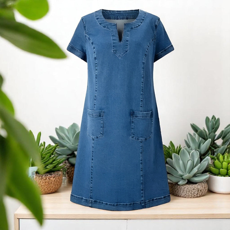 Close-up detail of soft denim dress fabric and flattering relaxed fit, available in sizes S to 3XL