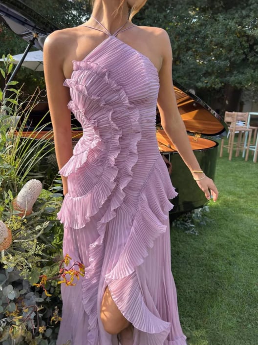 Close-up lifestyle shot of the Estelle halter dress fabric and pleat detail