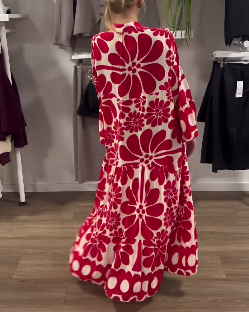 Side view of woman in red printed maxi dress showing fluid silhouette and elongating hem length