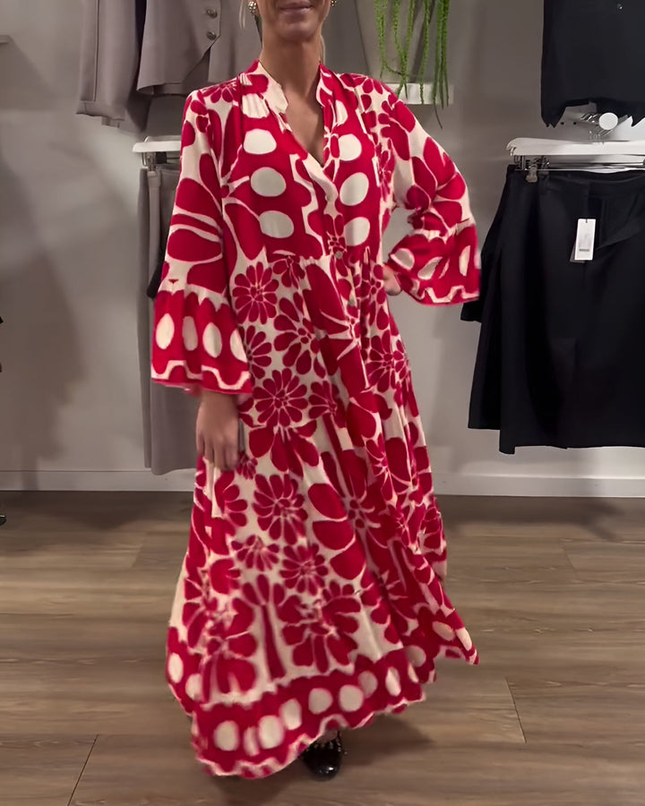 Back view of the Estelle red printed maxi dress highlighting draped design and graceful flow