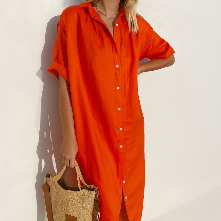Model wearing the Estelle midi shirt dress styled with sandals for a casual warm-weather look
