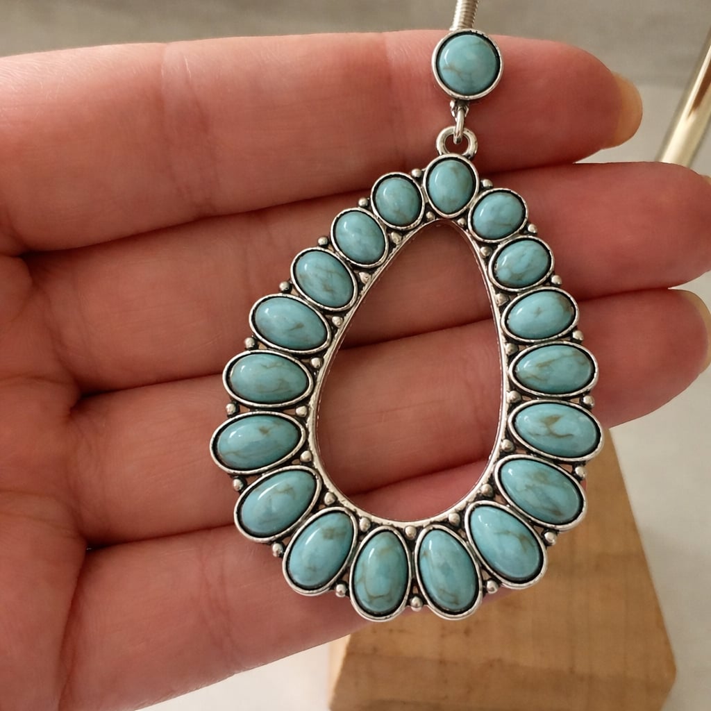 Detail view of turquoise earrings showing fastening and finish quality