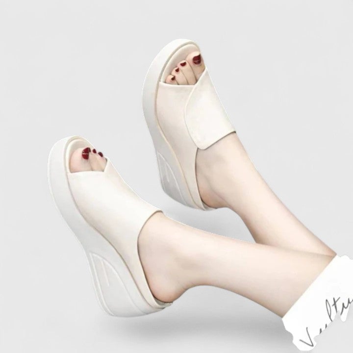Close-up of orthopedic wedge sandal showing cushioned wedge design and lightweight breathable upper