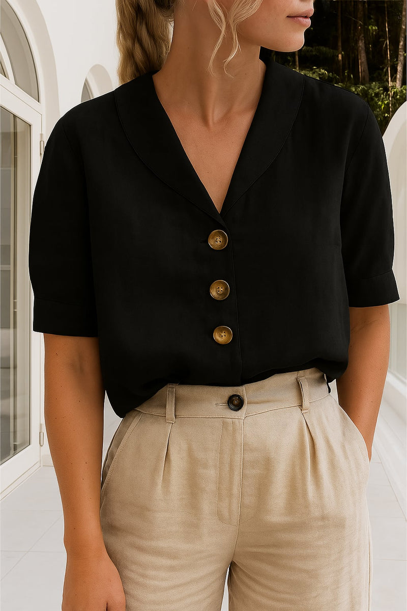 Ethel elegant blouse in black displayed on a model, paired with a midi skirt for an effortless evening outfit