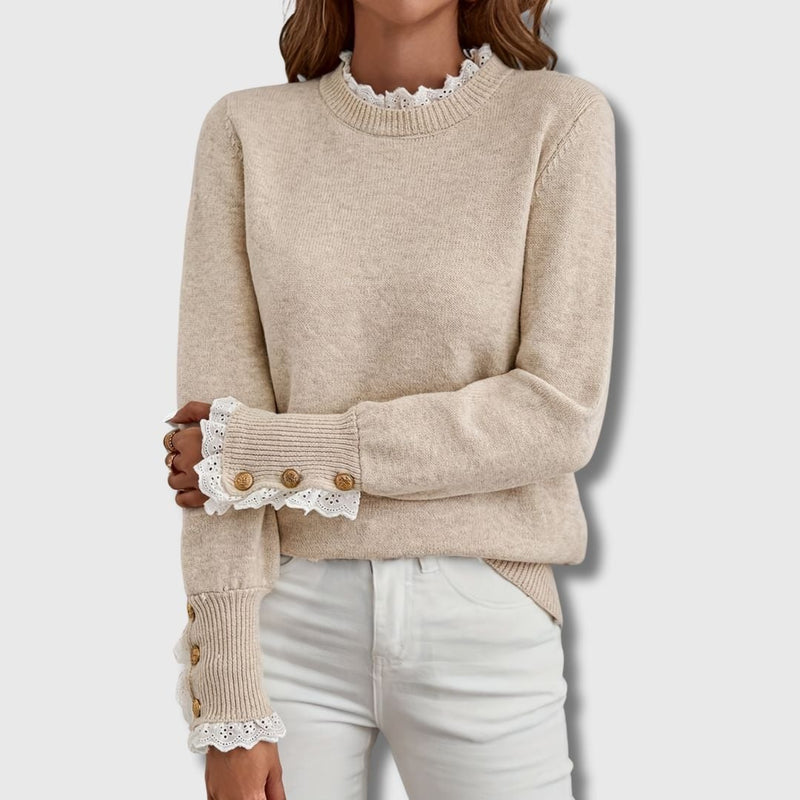 Woman wearing an apricot long sleeve sweater with delicate lace detailing, relaxed fit, styled casually