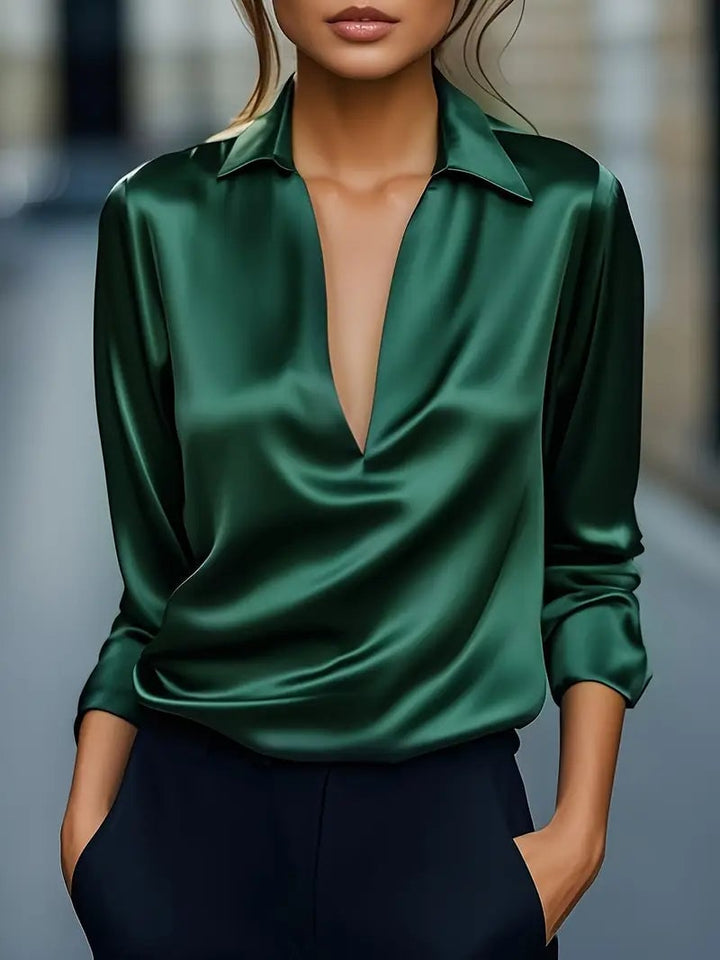 Green premium satin V-neck blouse with elegant drape — styled on model