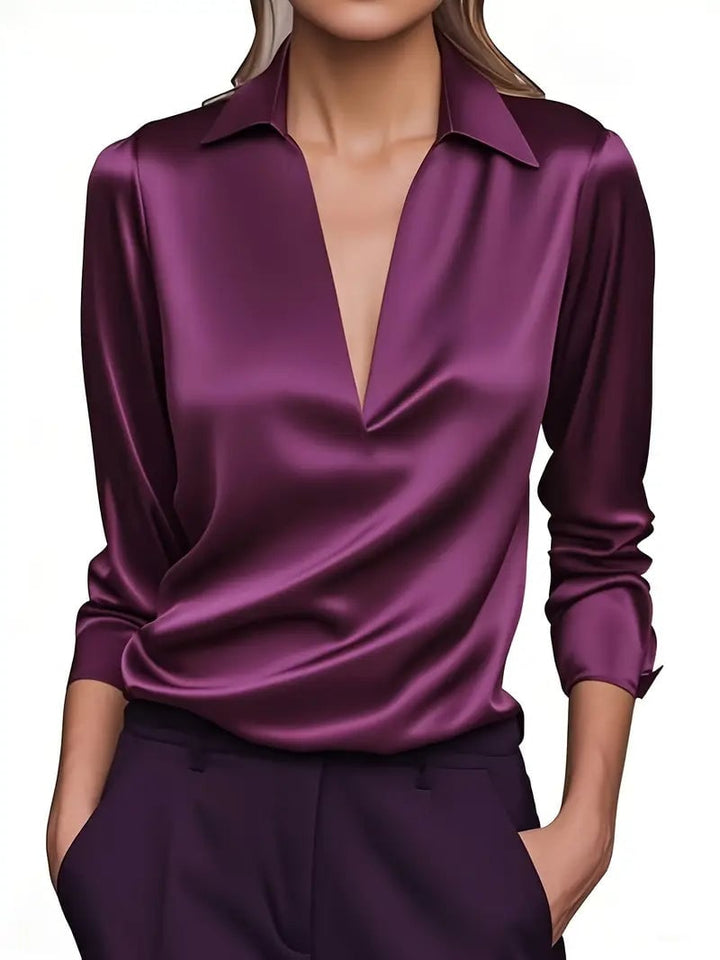 Green satin blouse back view highlighting smooth fabric and flattering fit