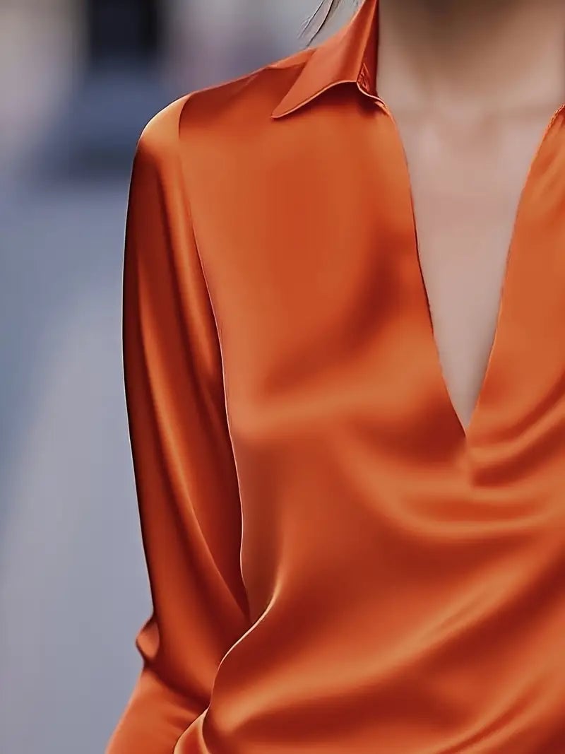 Light pink satin blouse styled with wide-leg trousers