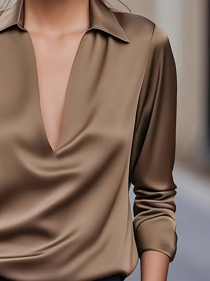 Pink satin blouse tucked into high-waisted skirt — styled look