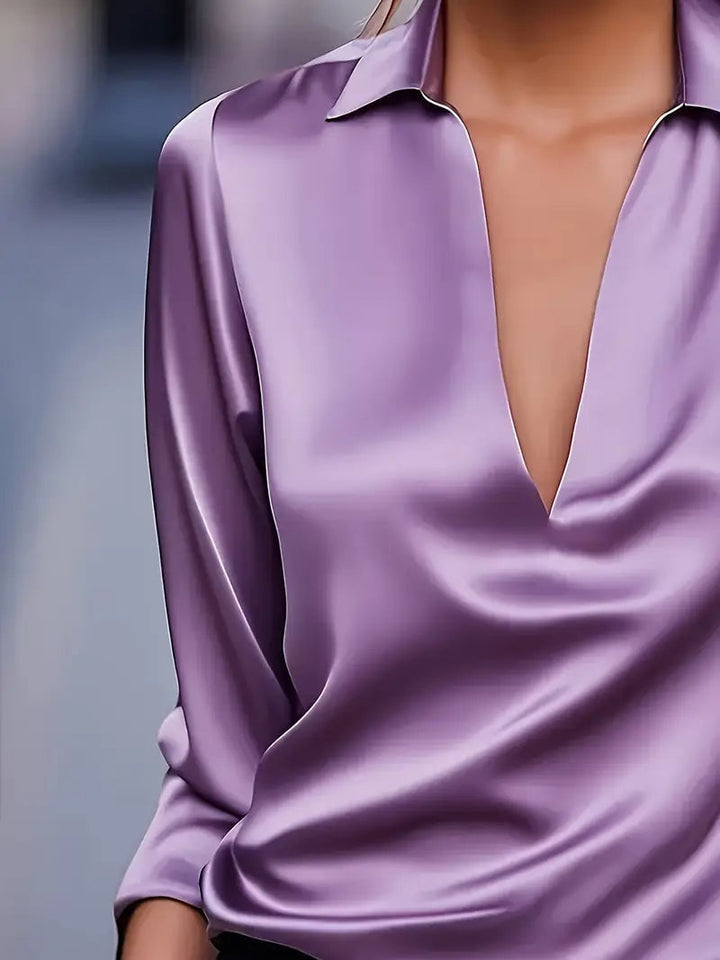 Purple satin blouse styled for an evening out