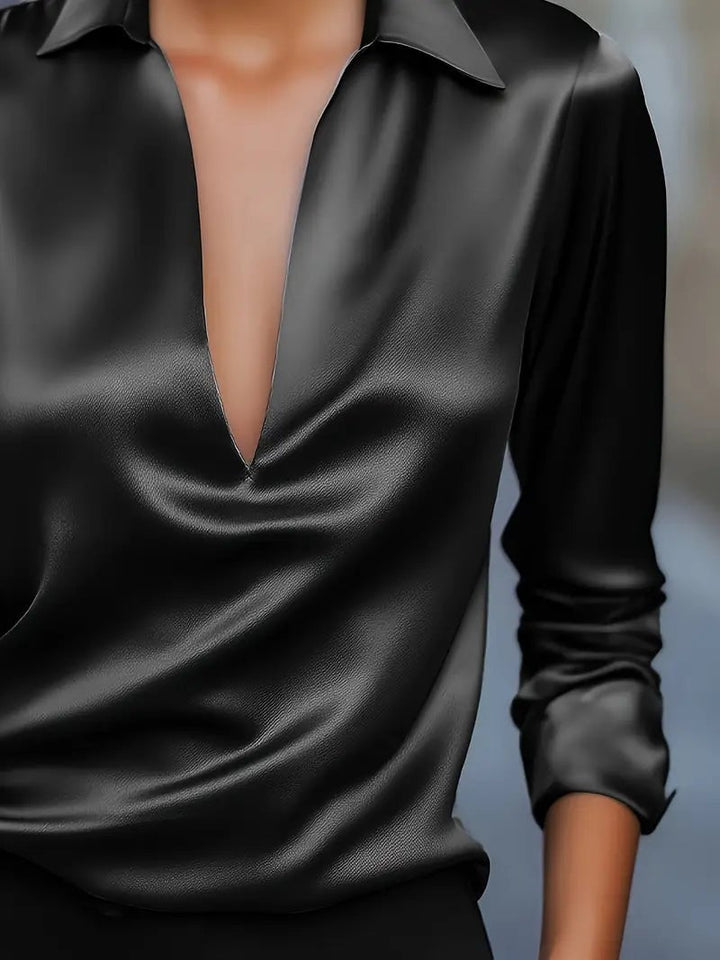 Grey satin blouse front button or closure detail close-up