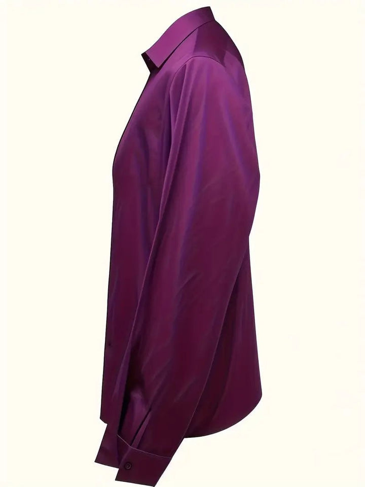 Pink satin blouse flat lay on neutral background