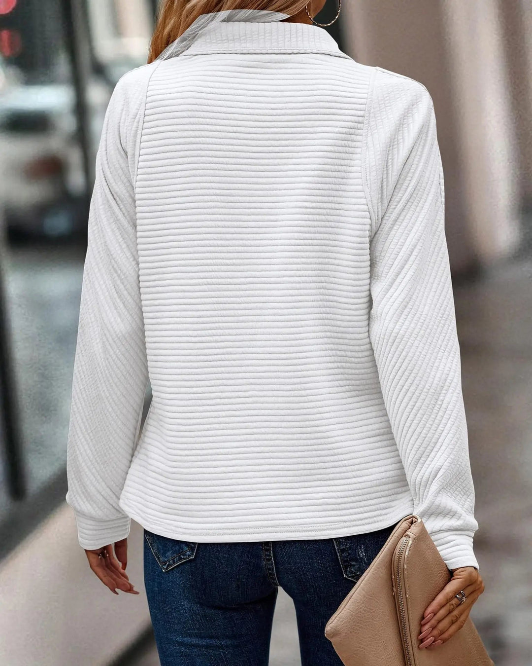 Model wearing the Evangeline zip sweater in maroon, smiling and styled for a cozy seasonal look