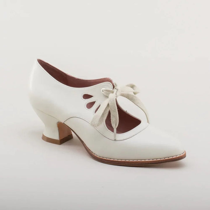 Evangeline women's flat cushioned sandals in white, side profile view