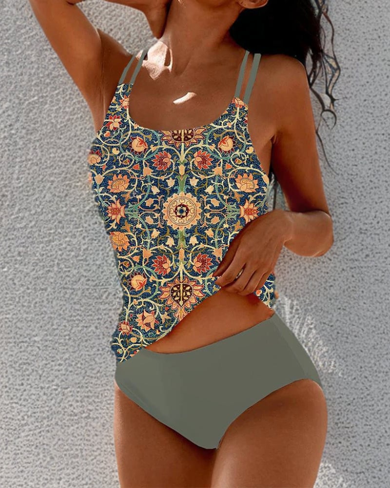 Close-up of the double-strap detail on the Evangeline swimsuit showing lift and support design