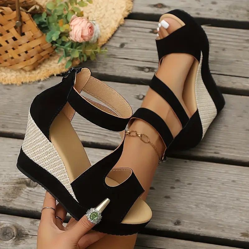 Side profile of the Evangeline black platform wedge sandal showing textured wedge heel