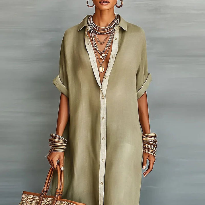 Side view of the Evelina button down maxi dress in green highlighting the flowing hem and relaxed fit