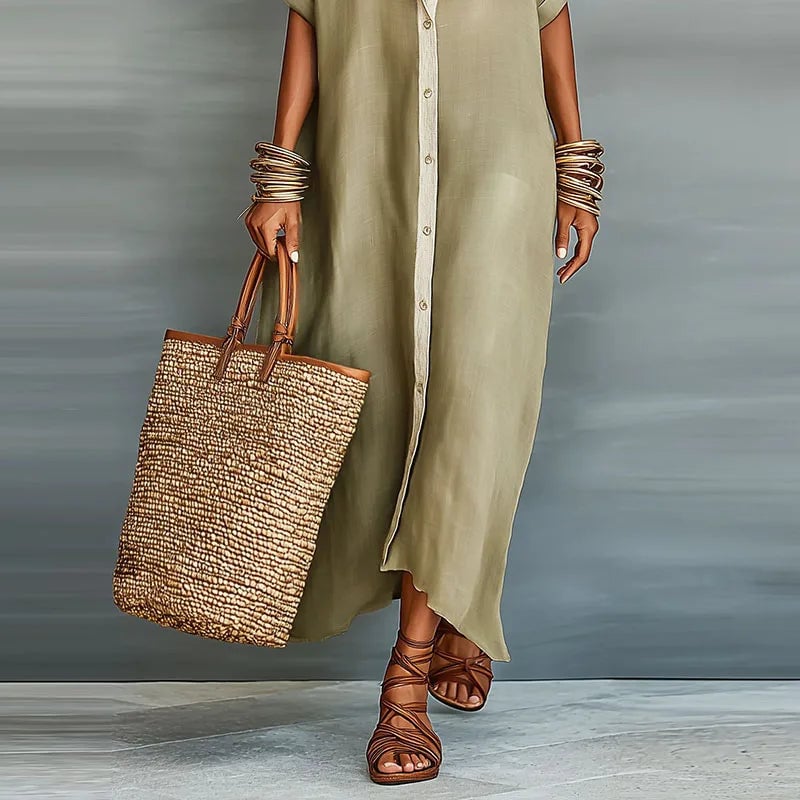 Close-up of the collared neckline and button down front detail on the Evelina shirt dress in light blue