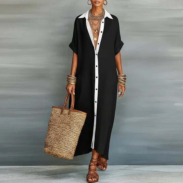 Woman styling the Evelina maxi shirt dress in pink with sandals for a casual warm-weather look