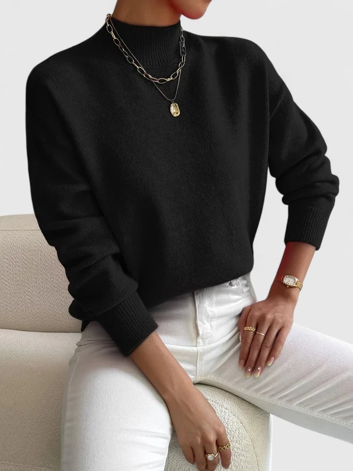 Woman wearing a black Evelyn turtleneck sweater, showcasing versatile everyday styling