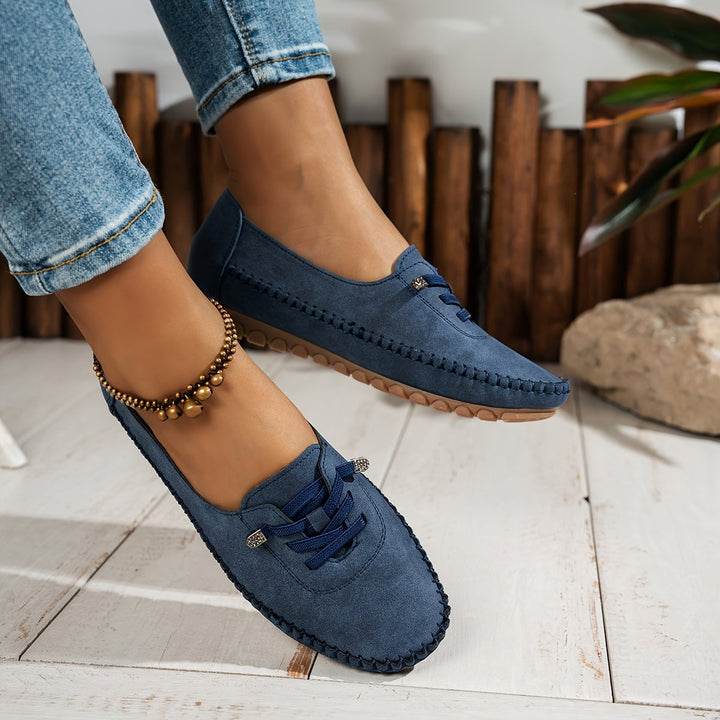 Evelyne loafers in pink worn with a flowy midi dress, lifestyle shot