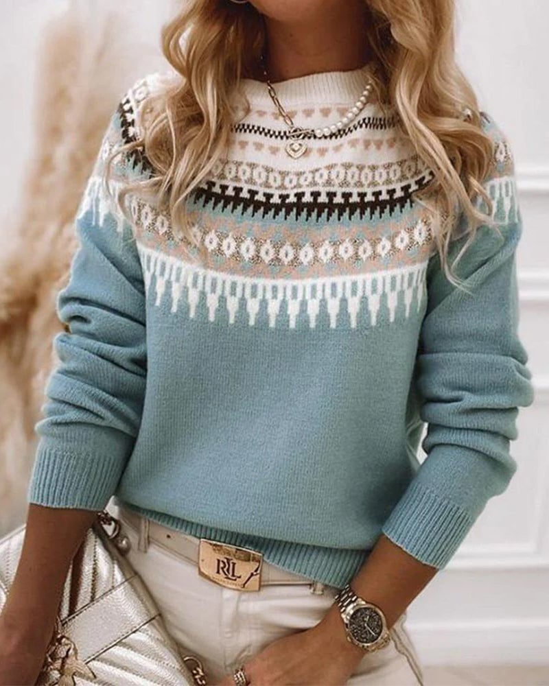 Model wearing the Everly knitted sweater in a relaxed fit, showcasing its soft cozy texture and classic silhouette