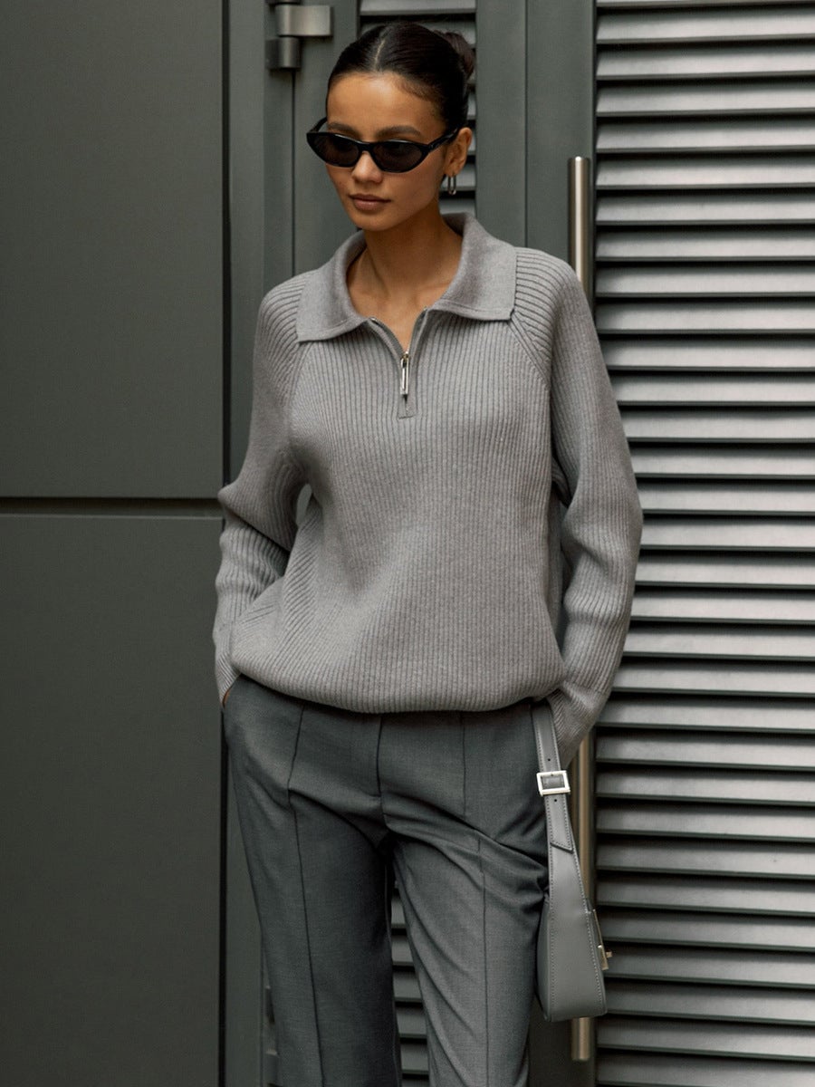 Model styling the Everly sweater in pink tucked into a midi skirt