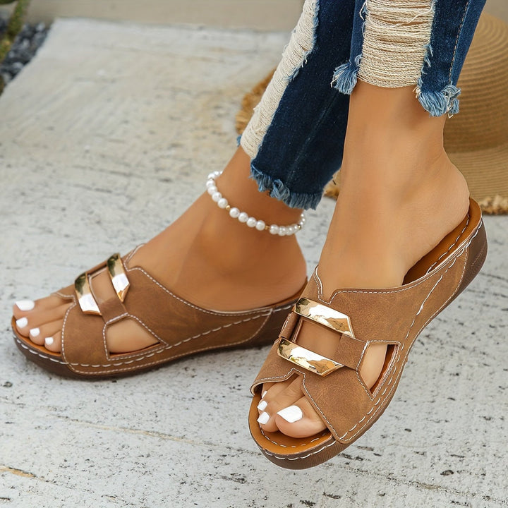 Top-down view of Everly black buckle sandals highlighting the adjustable strap