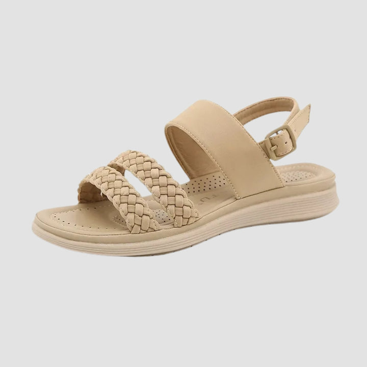 Close-up of the cushioned insole and supple vegan leather upper of the Everly sandal in beige