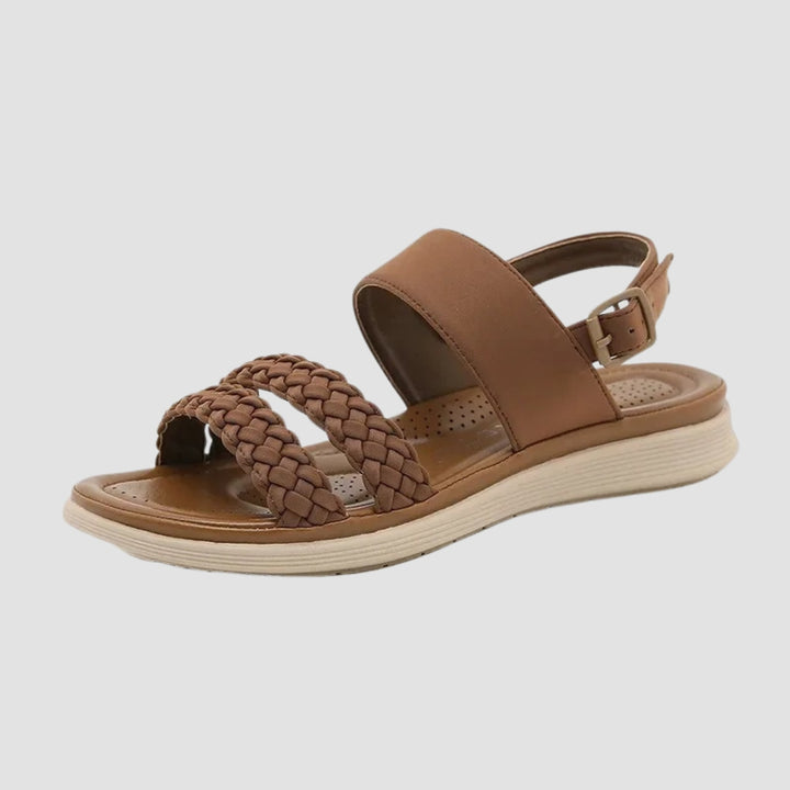 Side profile of the Everly vegan leather sandal in beige highlighting the flexible lightweight sole