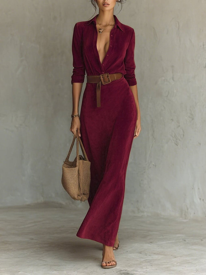 Model in a wine red suede maxi gown styled with heels for an elegant evening look