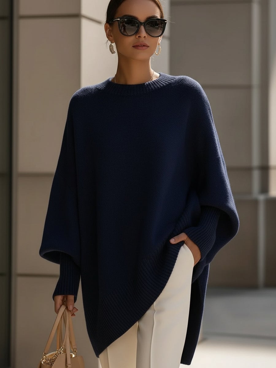 Side profile of woman in the Faith elegant sweater in beige, highlighting the graceful fit and ease of movement