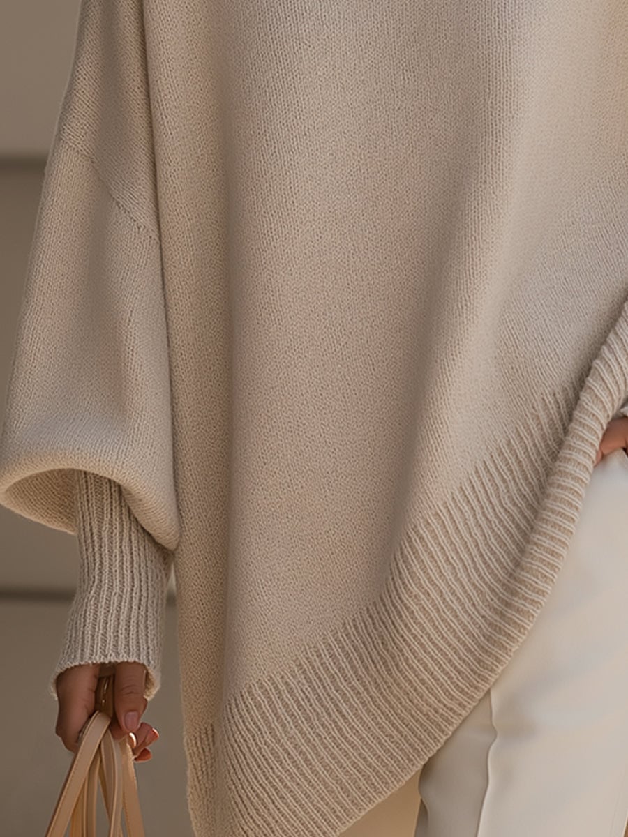 Woman smiling in the Faith elegant sweater in beige, showcasing its versatile and relaxed style