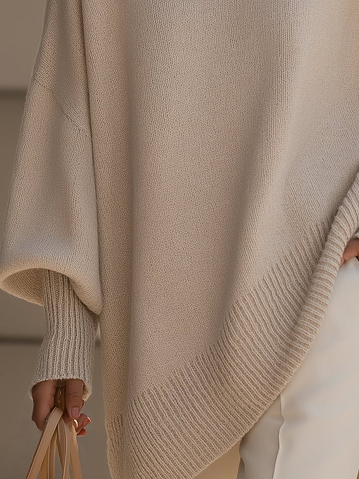 Woman smiling in the Faith elegant sweater in beige, showcasing its versatile and relaxed style