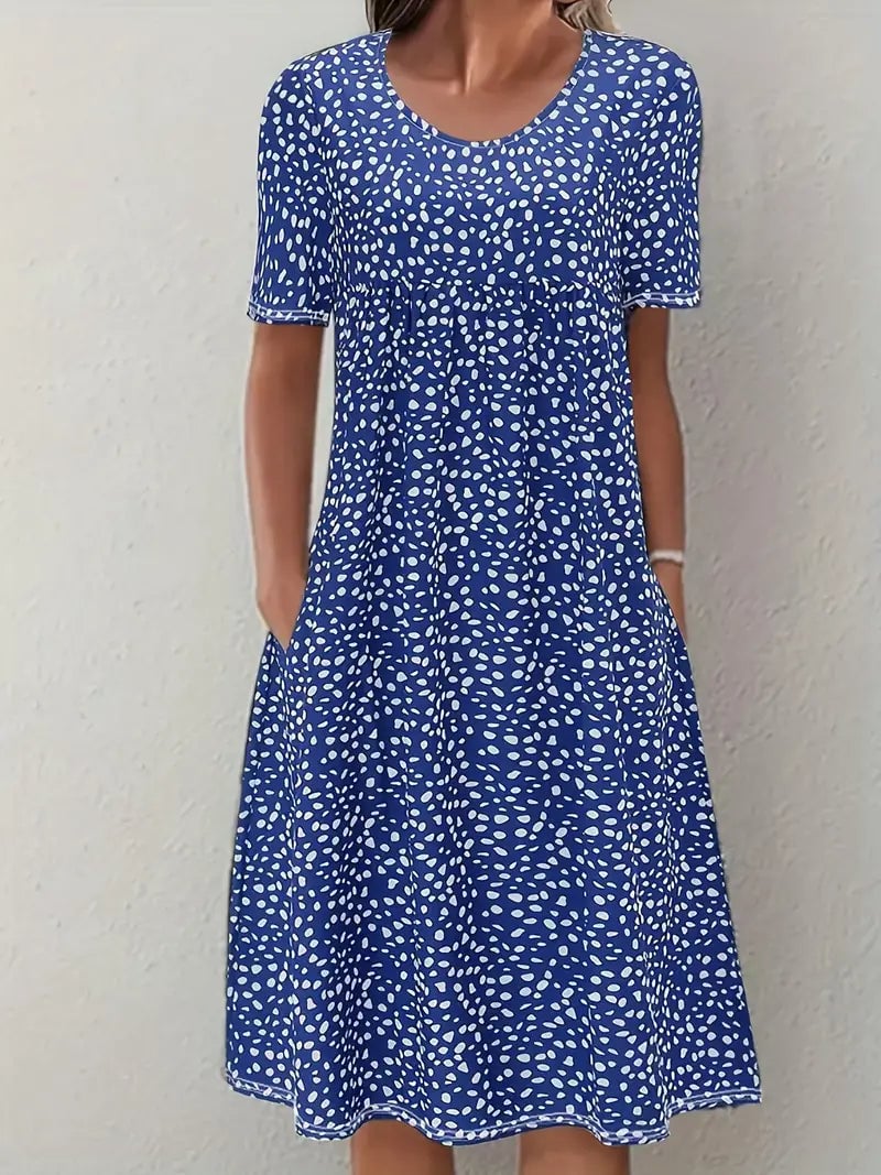 Side profile of the Faith flowy dress in blue, showcasing the smooth hip-skimming silhouette and lightweight fabric movement