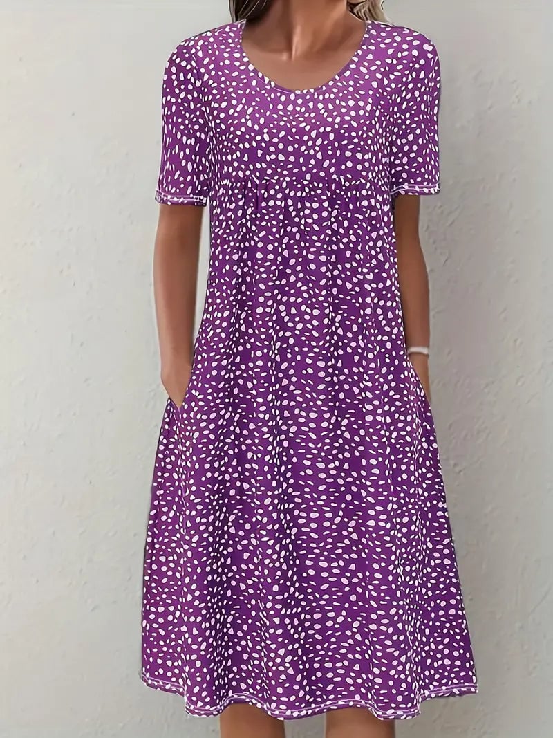 Close-up of the delicate neckline and refined seam finish on the Faith elegant evening dress in purple