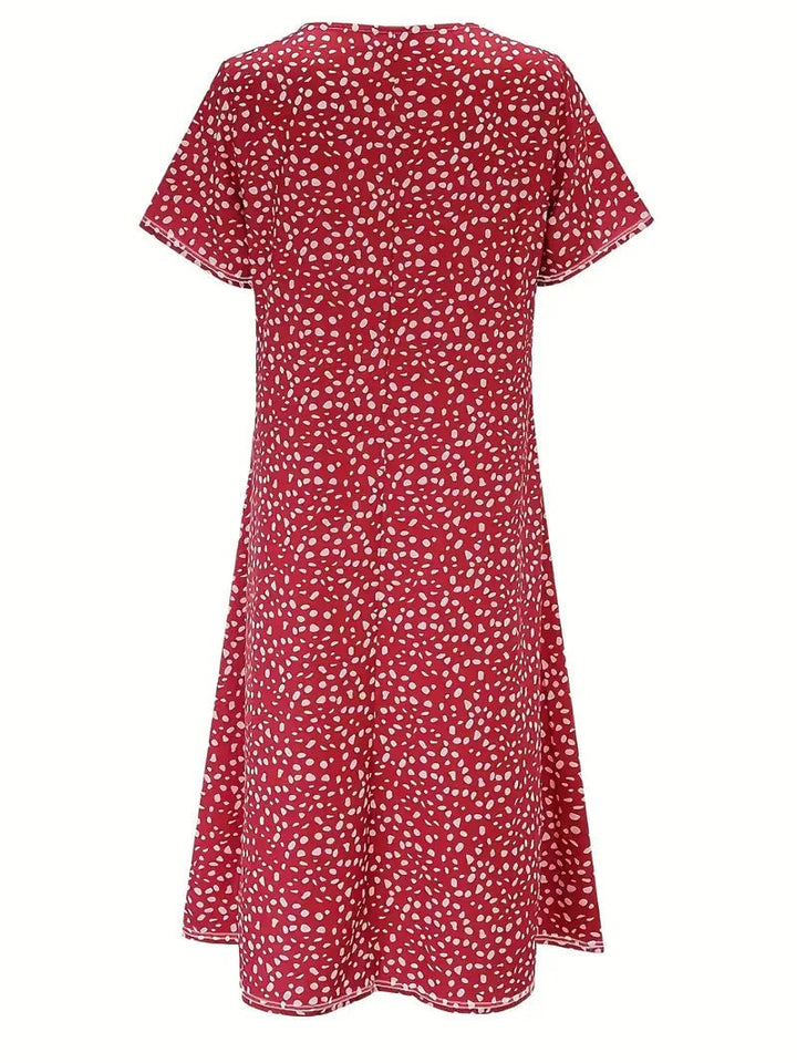 Model styling the Faith elegant dress with heels, showing a complete cocktail-ready evening look