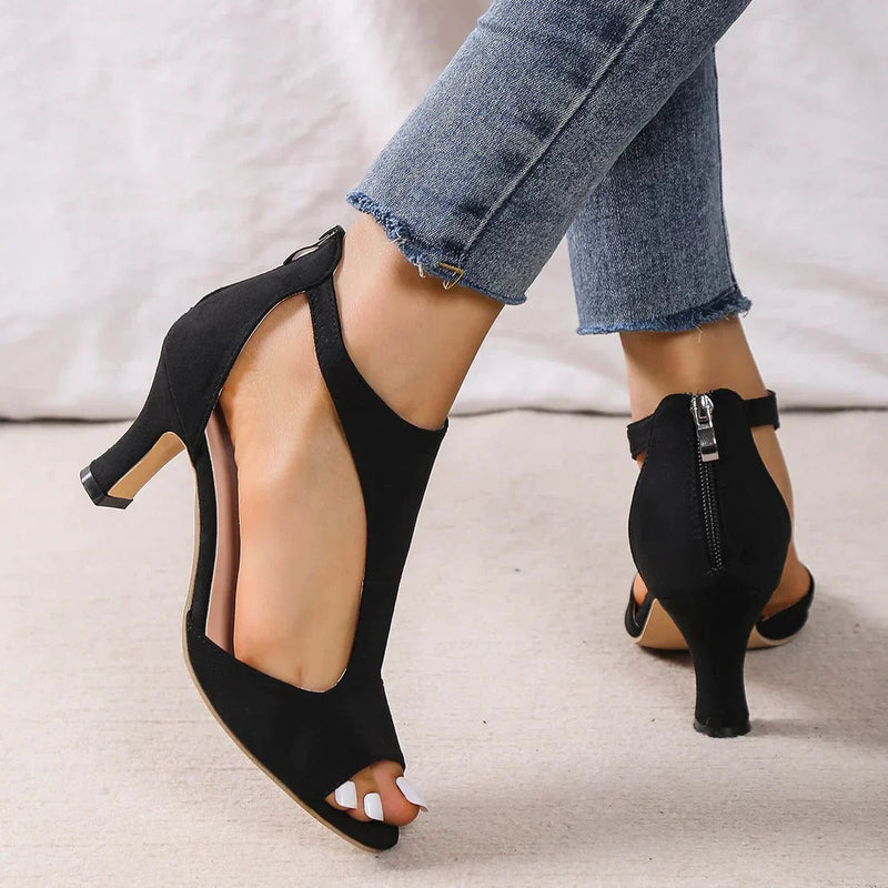 Faith women's low heel sandals in pink styled with a flowy dress, full-length lifestyle shot