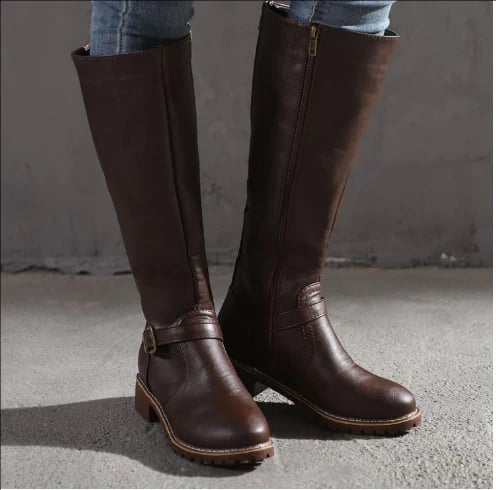 Fara knee-high boots in dark brown shown from a side angle highlighting the leg-lengthening design