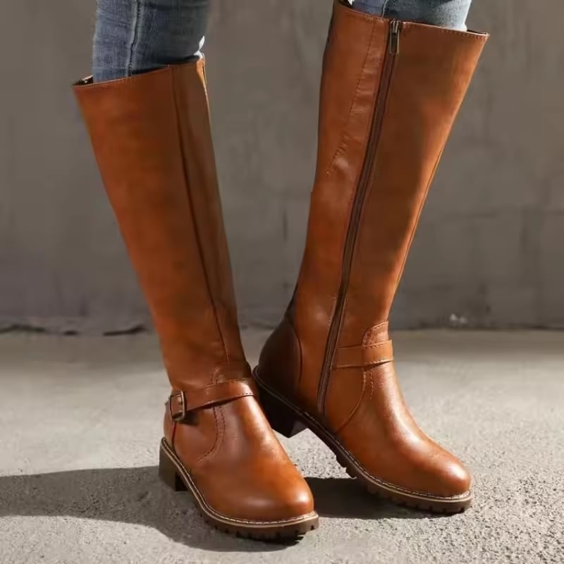 Light brown knee-high boots styled with skinny jeans, full-length lifestyle shot
