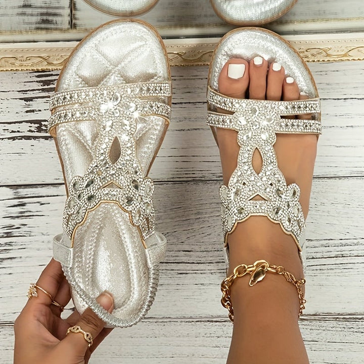 Farrah boho sandals in black on a neutral background, side view