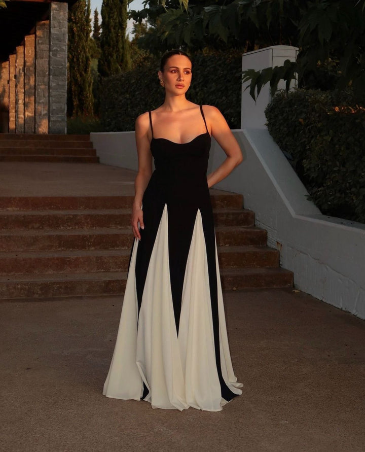 Back view of the Faye women's lace maxi dress showing elegant flowing skirt