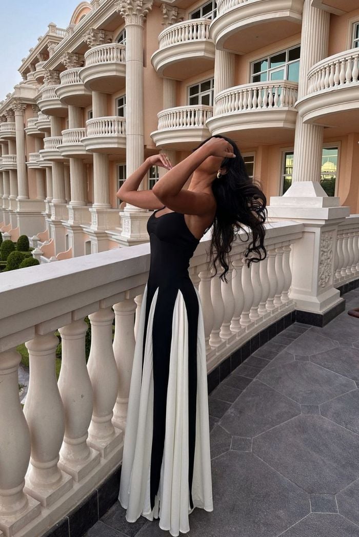 Model walking in the Faye lace maxi dress, showing fluid skirt drape