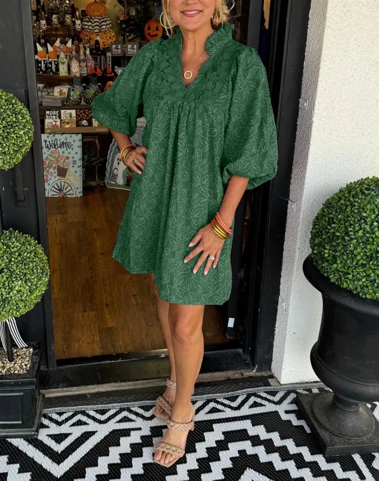Woman in the Faye mini dress styled with strappy heeled sandals for a summer occasion look