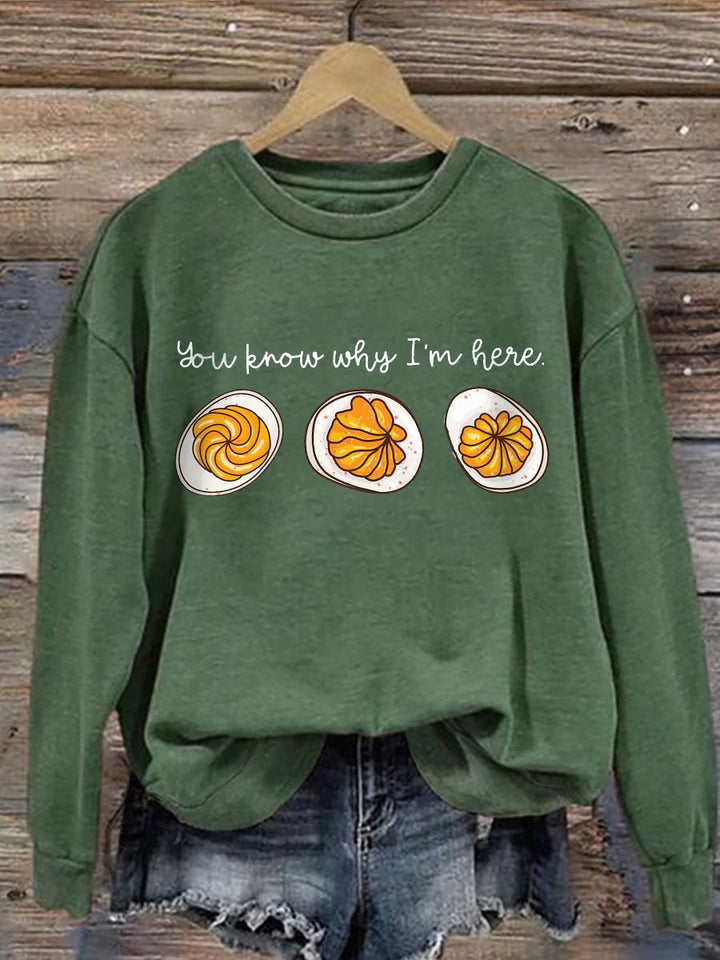 Front view of the Feast Mode sweatshirt showing playful holiday graphic print on a cozy pullover