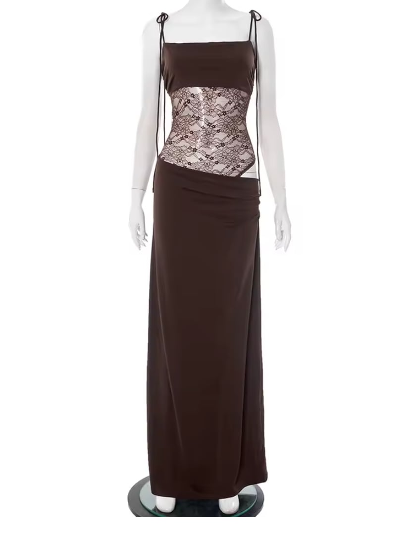 Flat lay of long lace-detail dress showing fabric texture and lace panel
