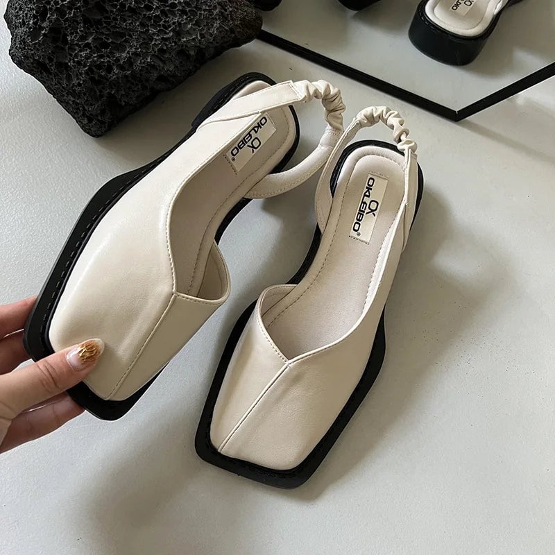 Felicity black orthopedic slip-ons, heel view showing low-profile ergonomic design