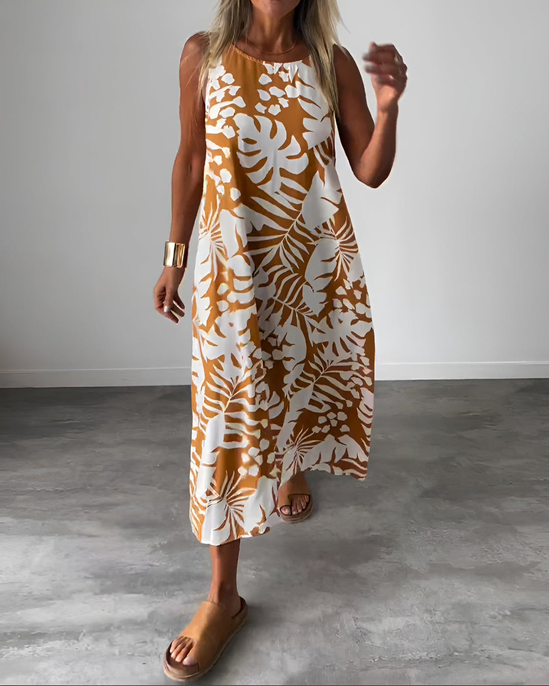 Woman wearing the Felicity sleeveless draped evening dress in brown, full-length front view