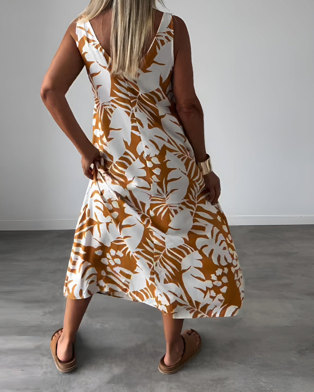 Flat lay of the Felicity sleeveless draped evening dress in blue showing fabric and drape detail